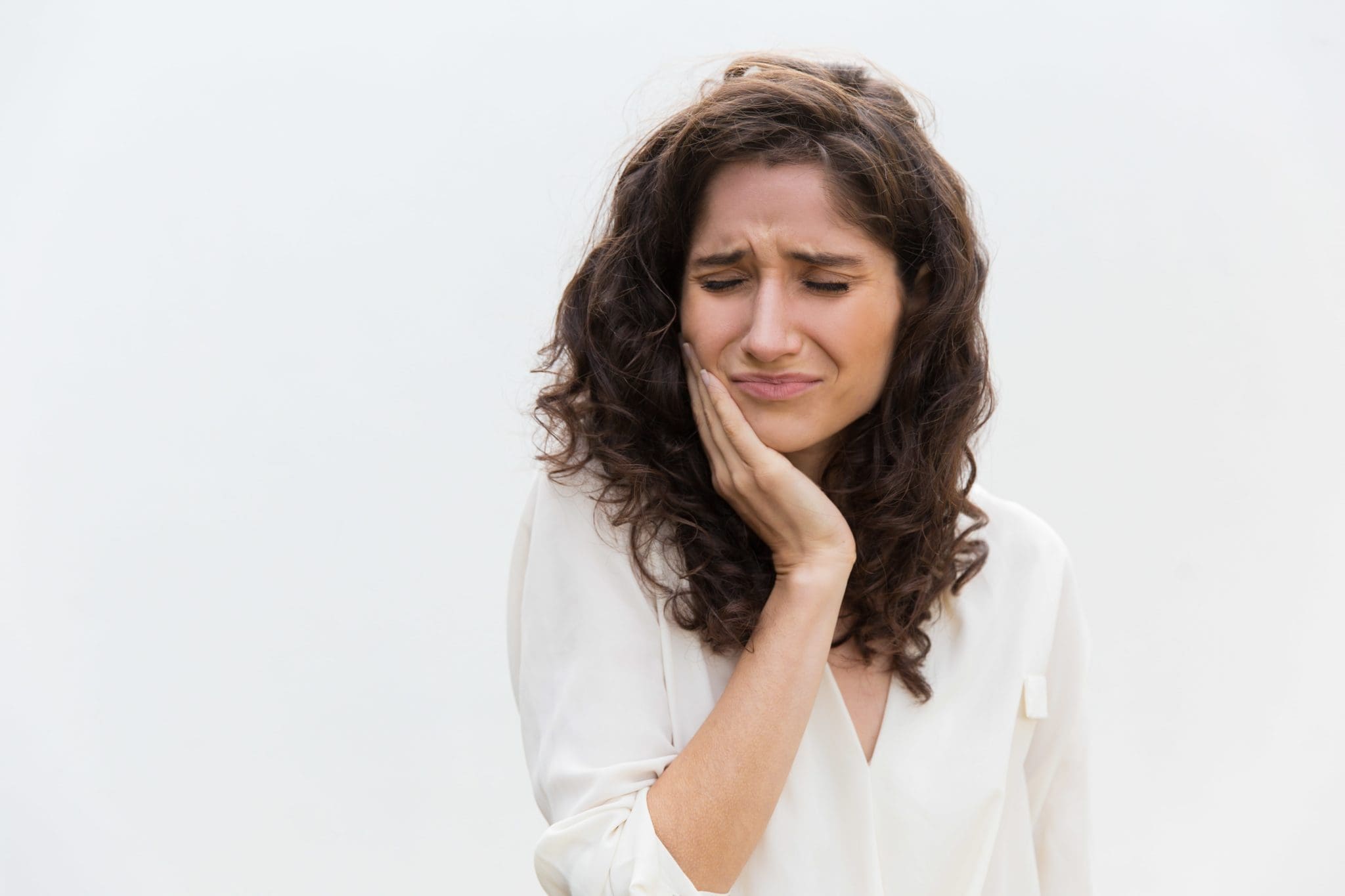 frustrated-unhappy-woman-suffering-from-toothache-min-scaled